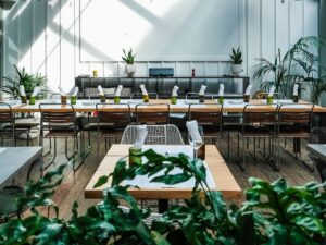 White oak table built by SouthLoft sits in the dining space of 60 Vines.