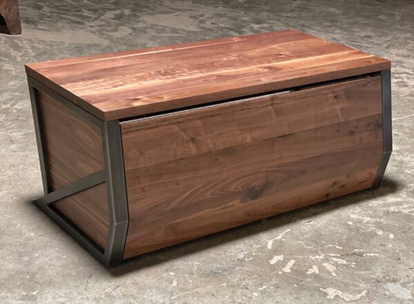 South Loft executive desk in walnut wood with angular metal framing on a concrete floor.