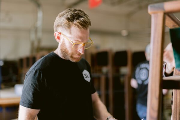 South Loft designer reviewing a project in the workshop.