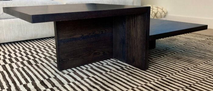 South Loft custom dark wood coffee table with modern geometric design.