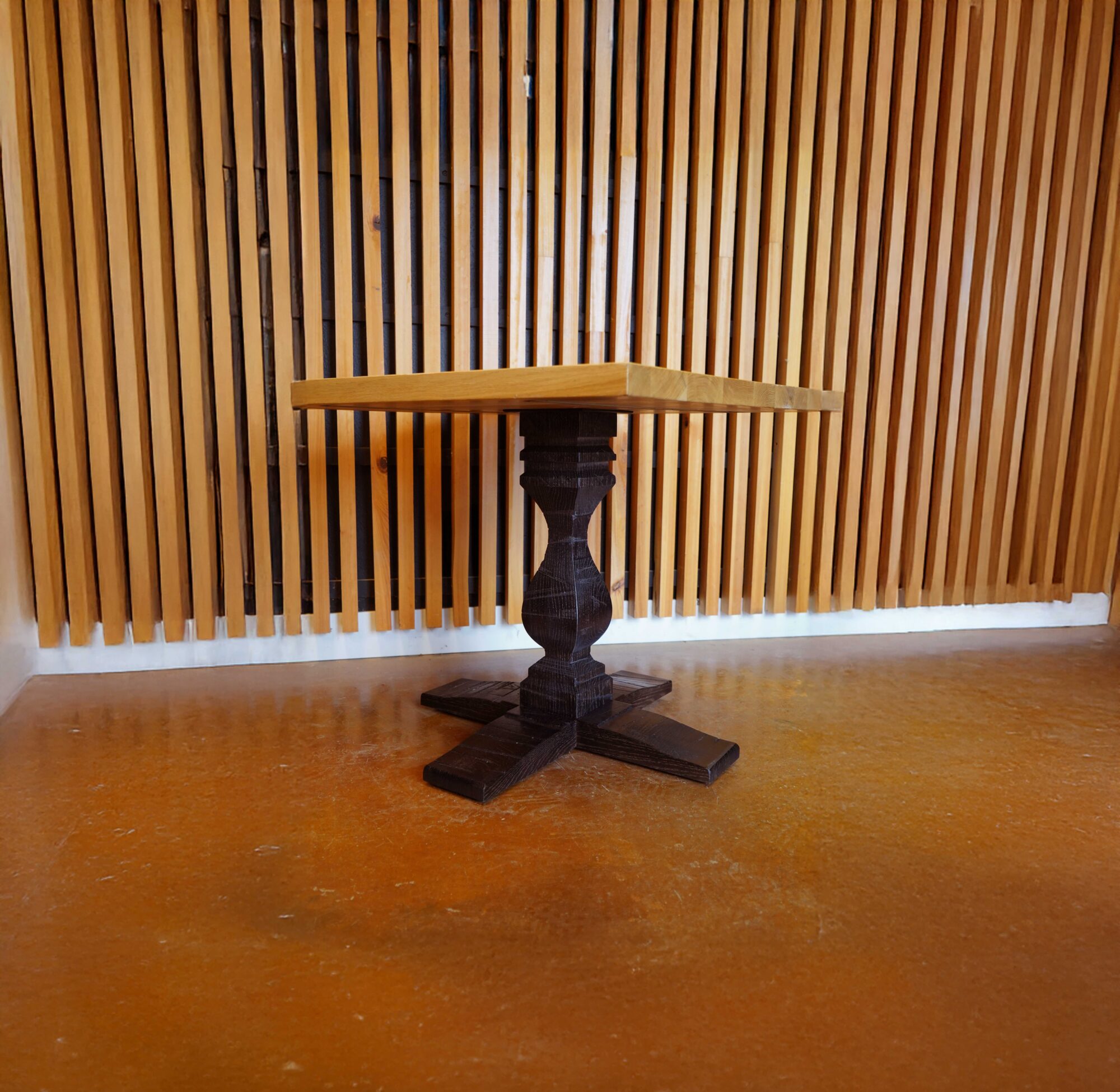 A 260 Series base from SL Commercial sits in the front of the SouthLoft production facility. This pedestal base has a unique custom profile and dark black finish.