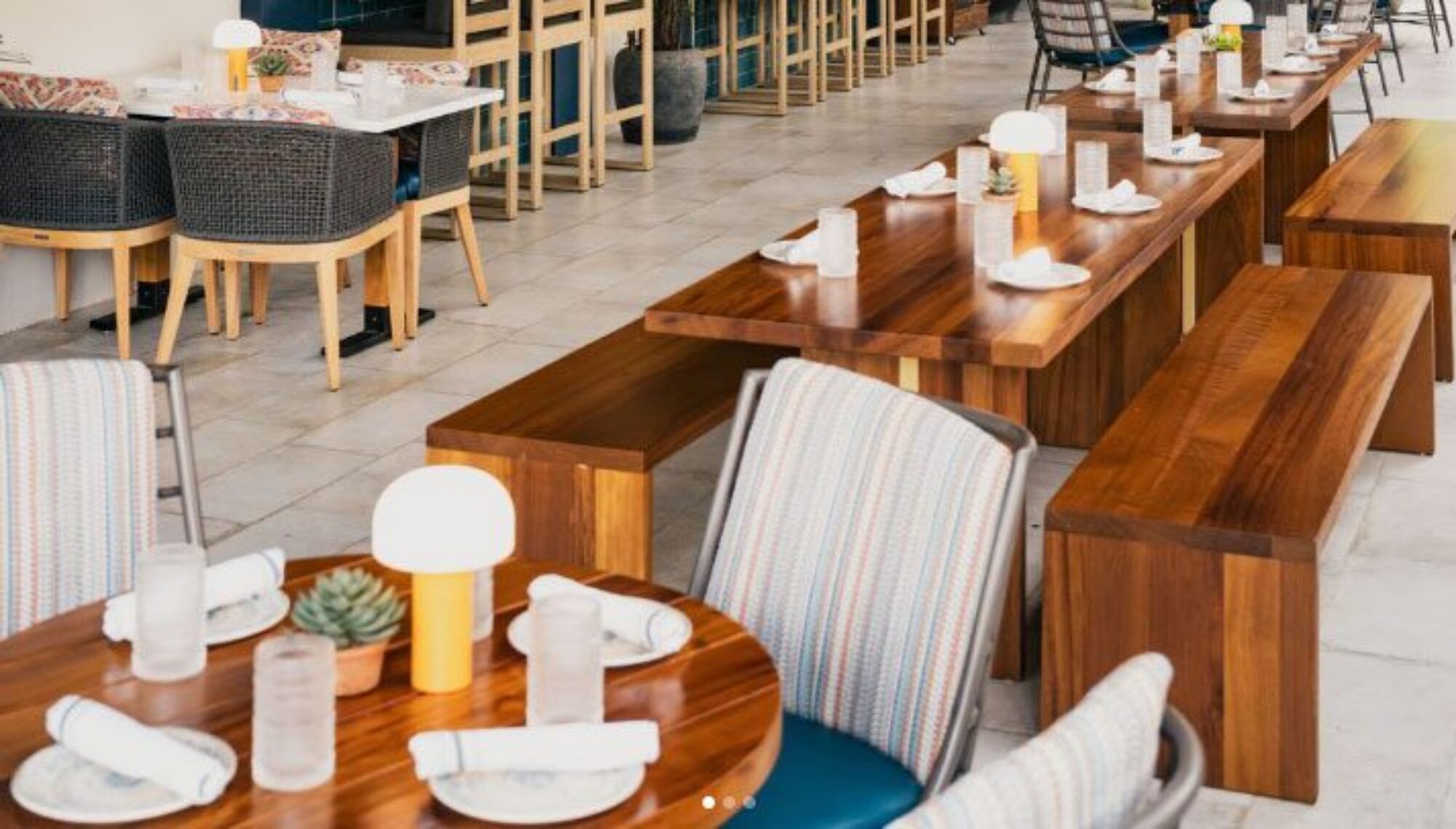 SouthLoft bench seating and tables adorn a Mexican Sugar patio seating area