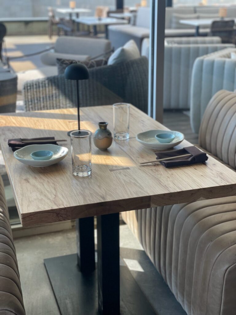 Image of table for SouthLoft client Musume with bowtie details.