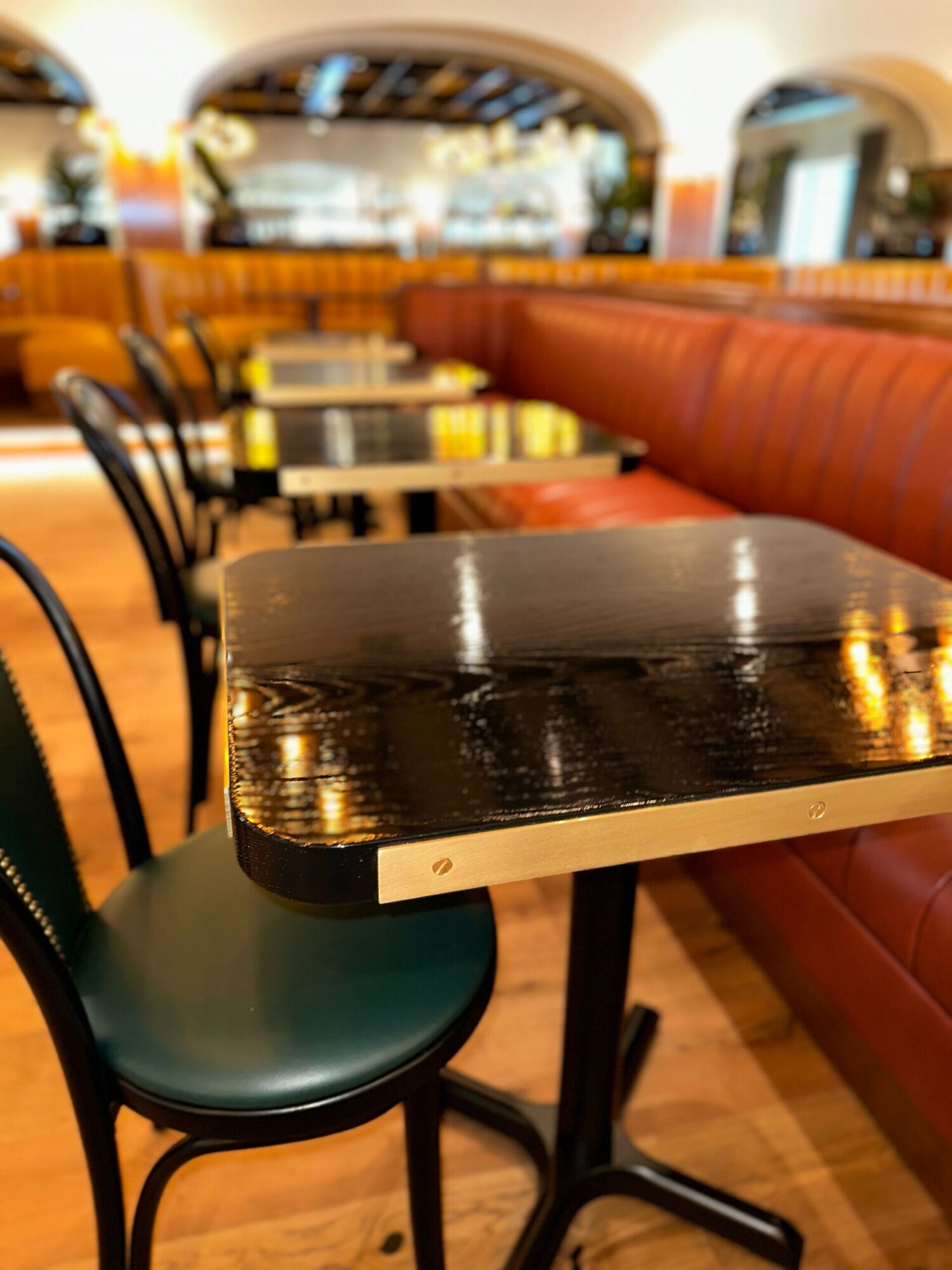 Detailed photo of SouthLoft built table with metallic banding and fasteners in focus.